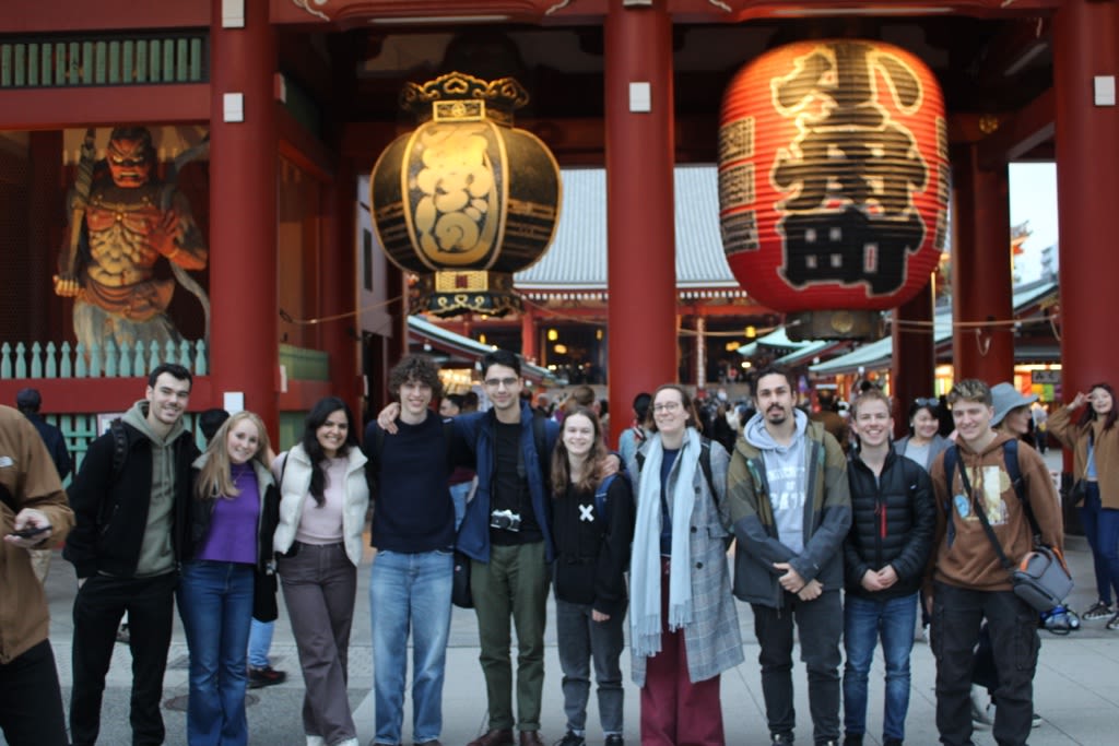 A group image of Team Bath Heart outside a traditional Japanese temple on their trip to Japan