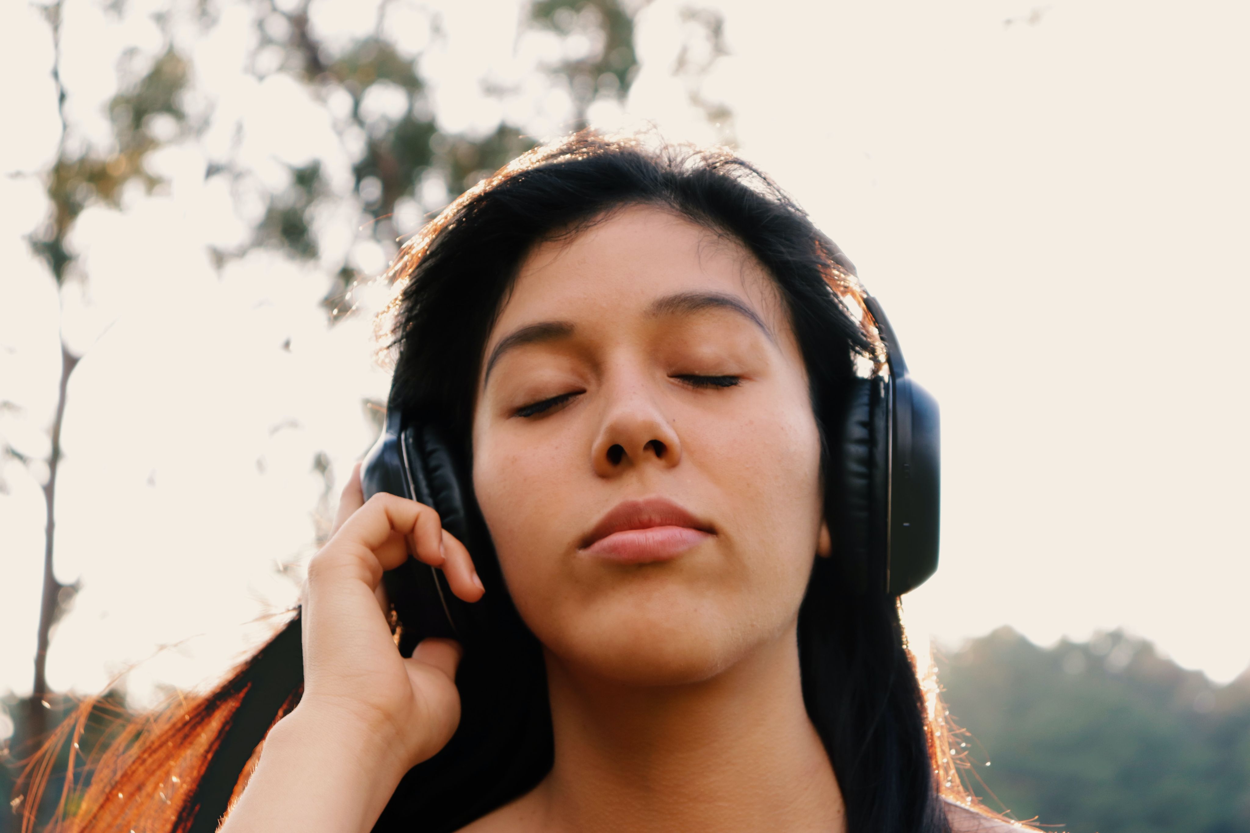 woman in black crew neck shirt wearing black headphones