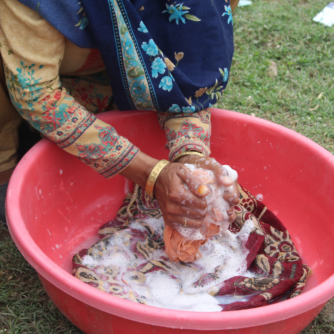 Close up of woman hand-washing clothes