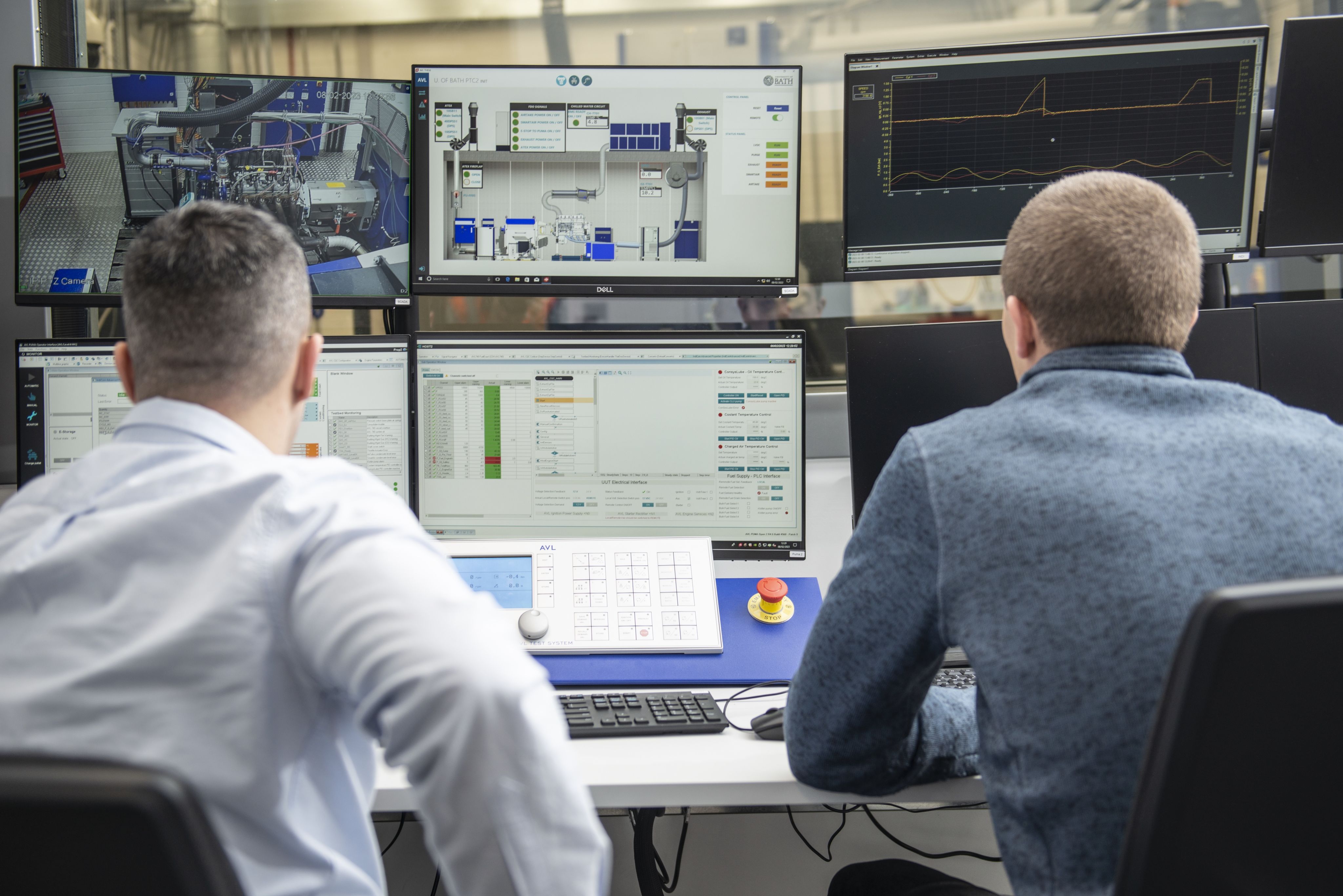 IAAPS researchers working on a control desk outside a test cell at the facility